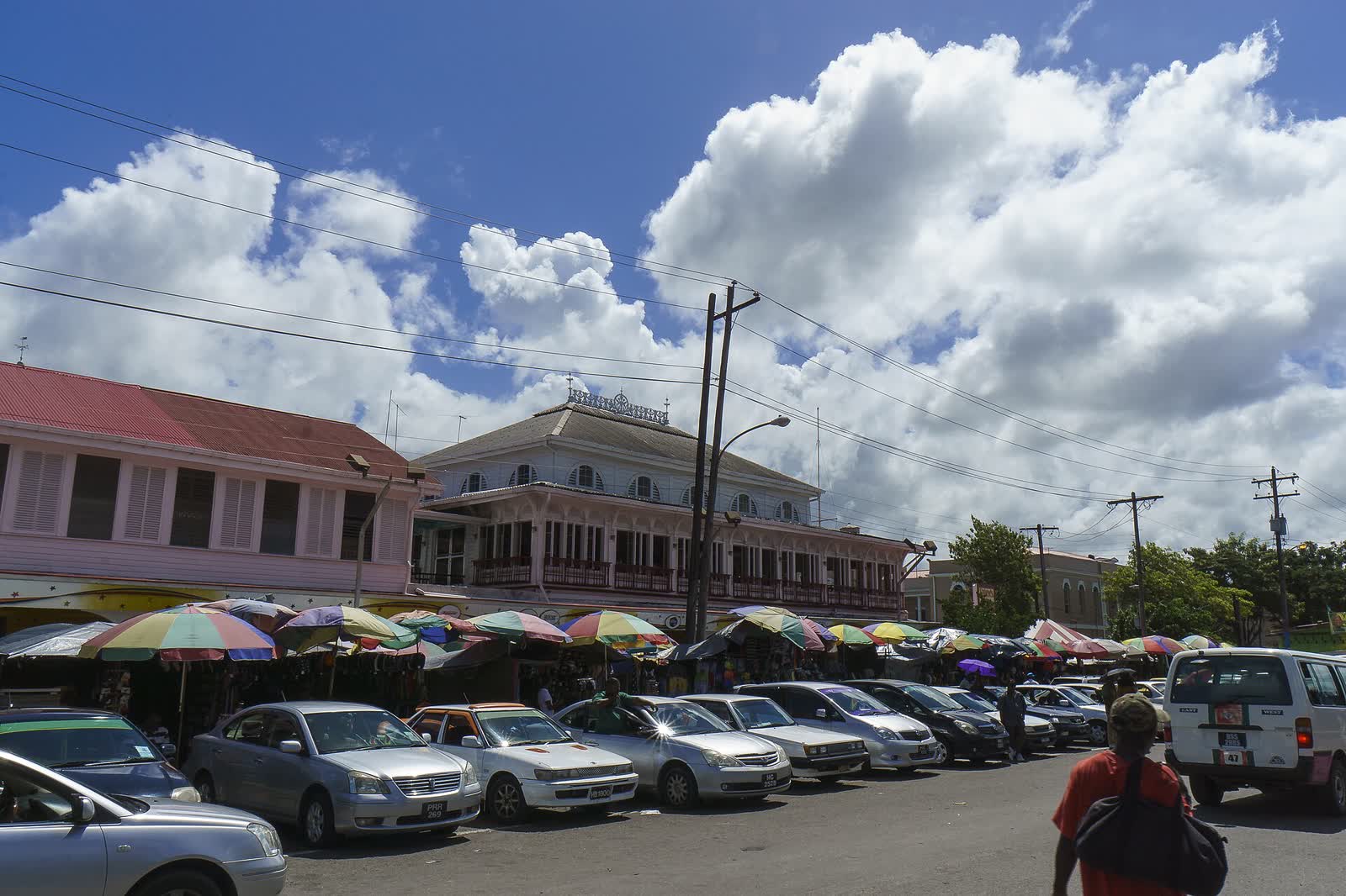 Street in Georgetown, Guyana with parked cars