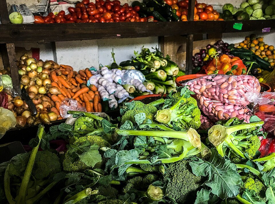 Fresh vegetables on a market stall — illustrative grocery image